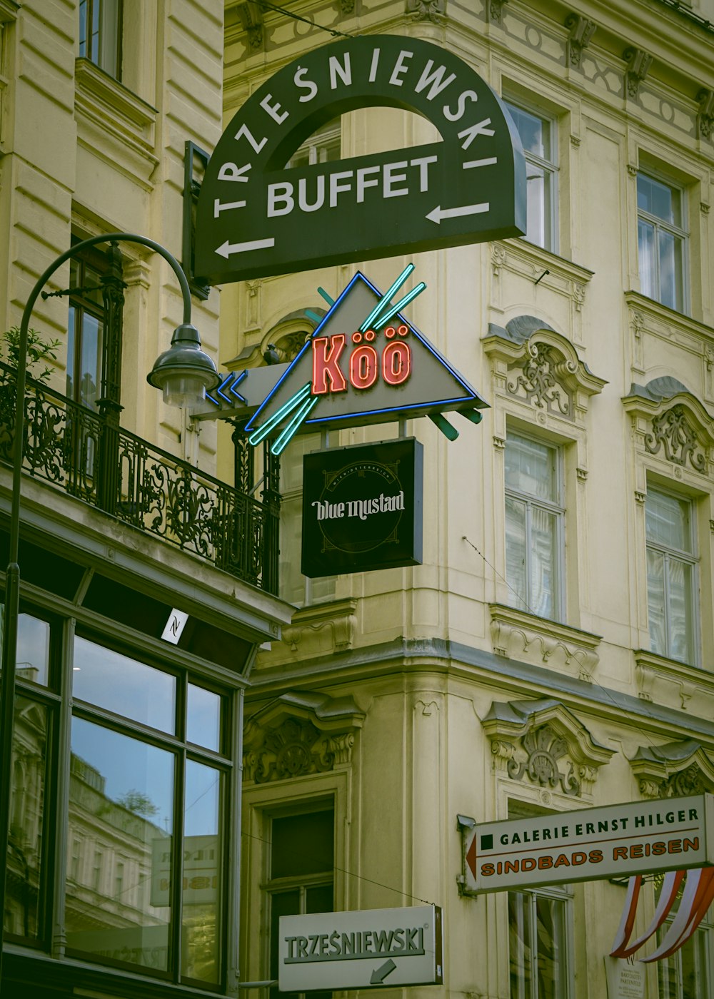 a building with a neon sign on the front of it