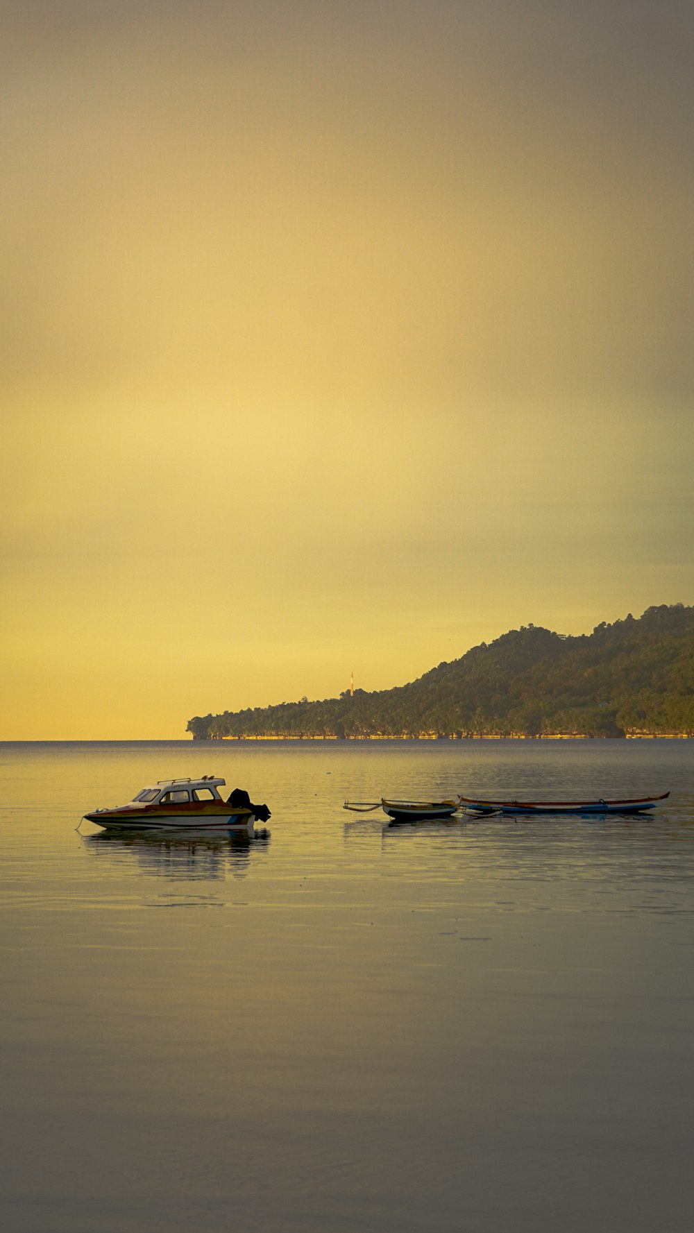 white and brown boat on sea during daytime