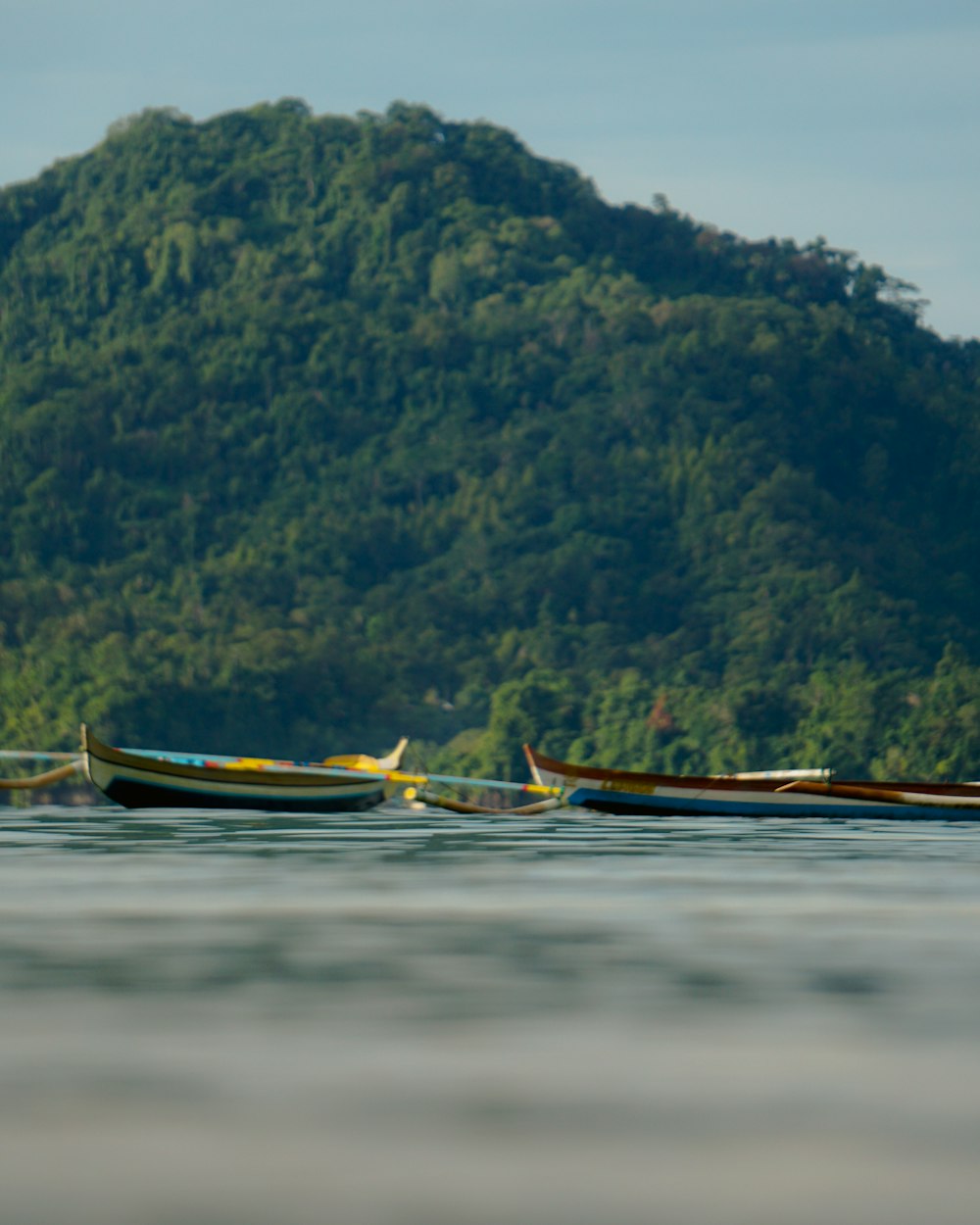 brown boat on body of water during daytime