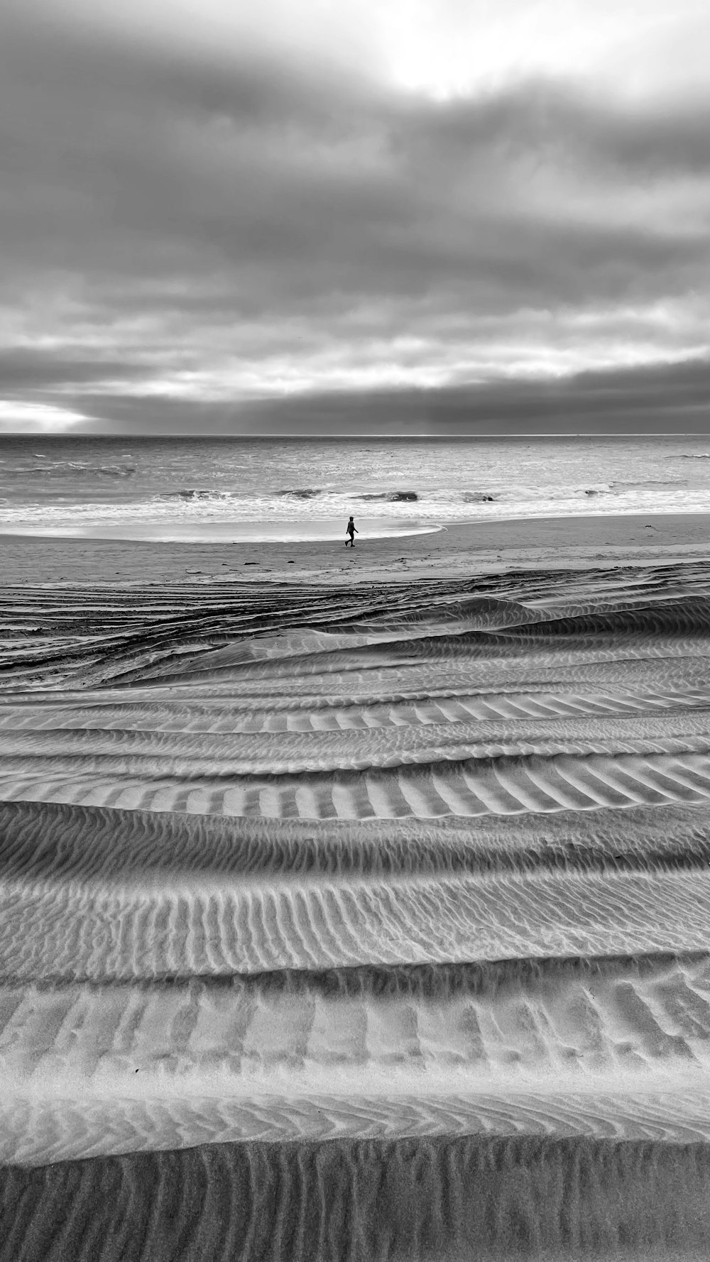 person walking on beach during daytime