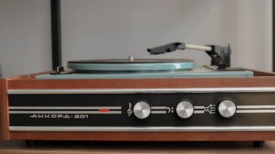 A vintage record player table with elegant details.