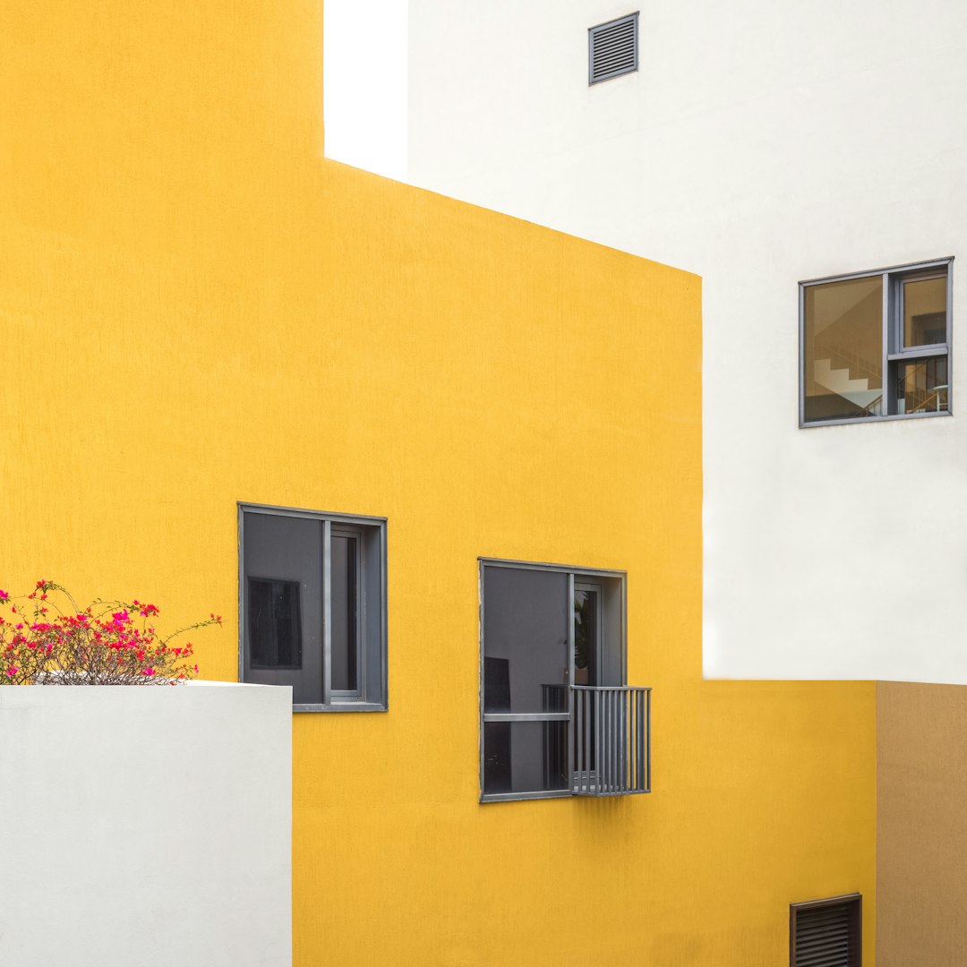 yellow concrete building with window