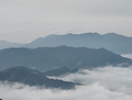 Morning mist rolling over the mountain range of Acayotla, with the farm below.