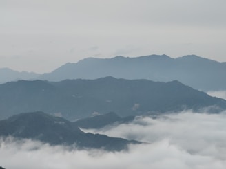 Morning mist rolling over the mountain range of Acayotla, with the farm below.