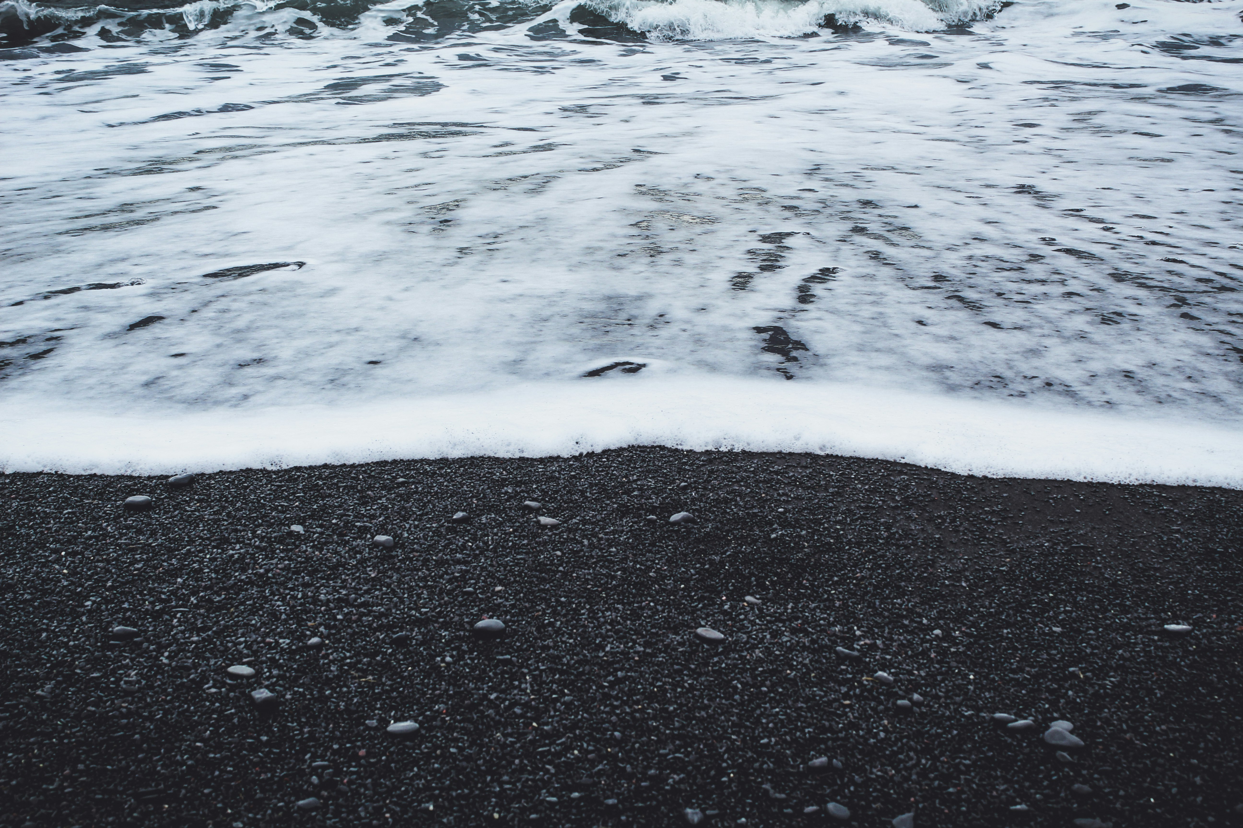 water waves on black sand