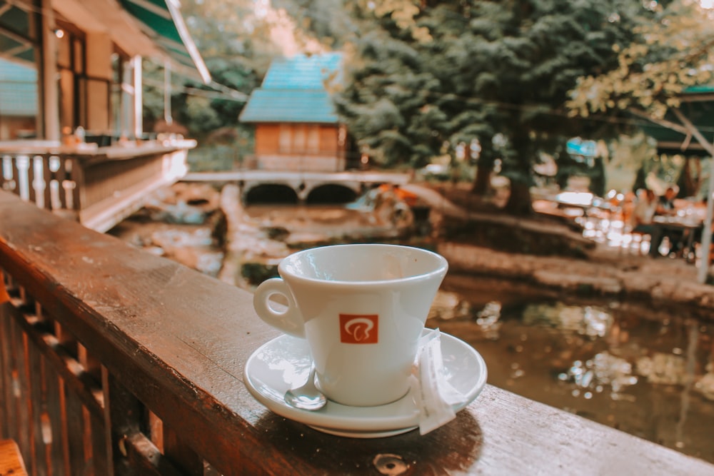 white ceramic cup on white ceramic saucer