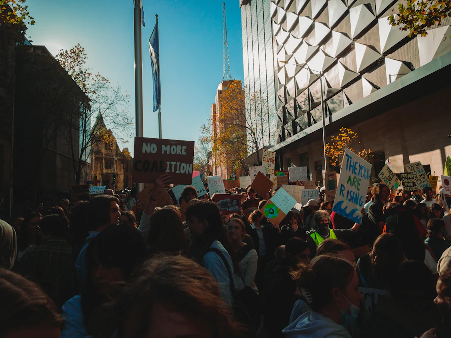Large crowd lining a Melbourne street for a public parade