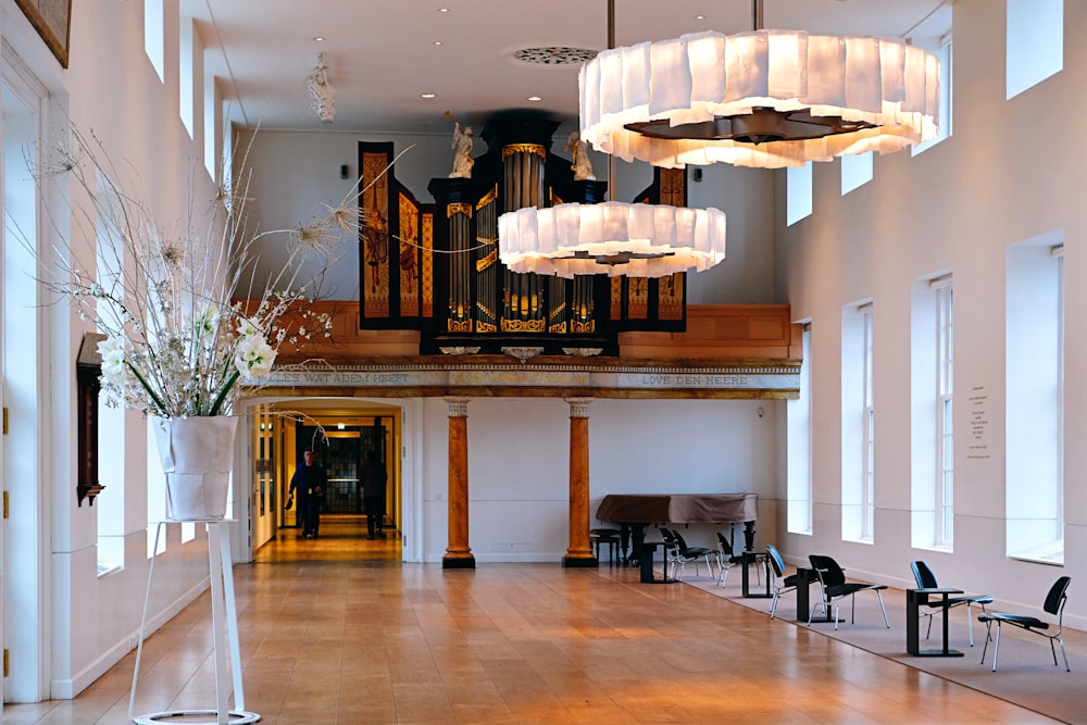 white and brown chandelier on white ceiling