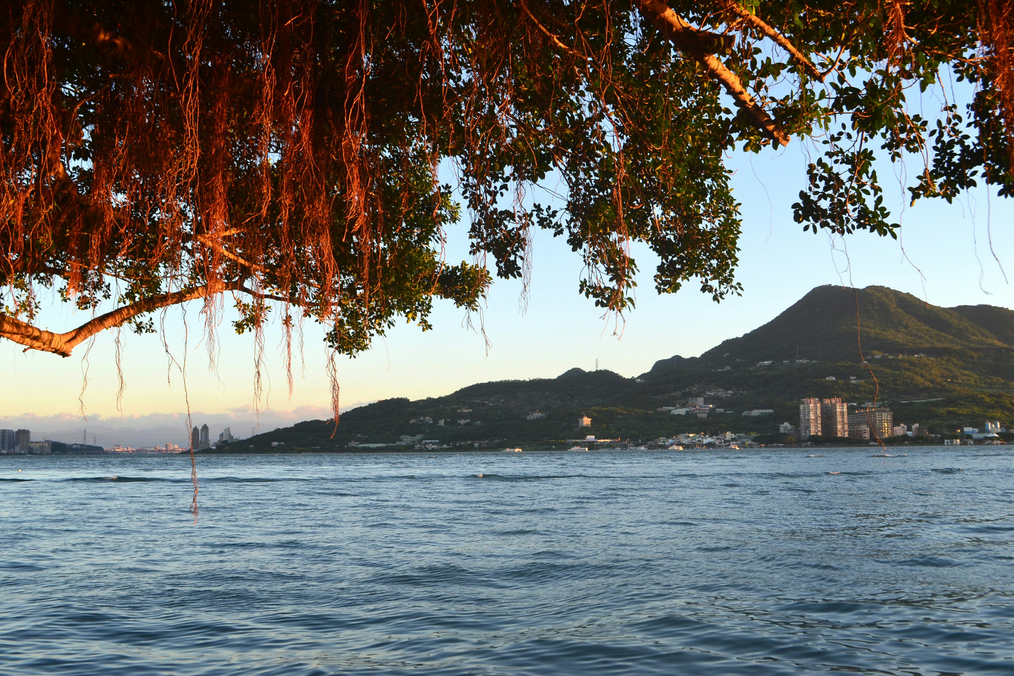 Tamsui River and Guanyin Mountain in warm evening light