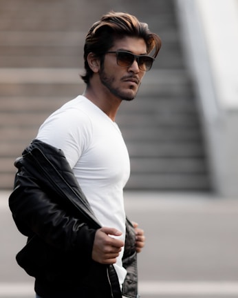 A person wearing a stylish t-shirt in an urban setting.
