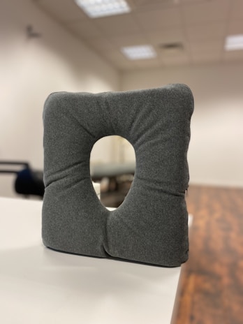 Memory foam seat cushion designed ergonomically for coccyx and hemorrhoid relief