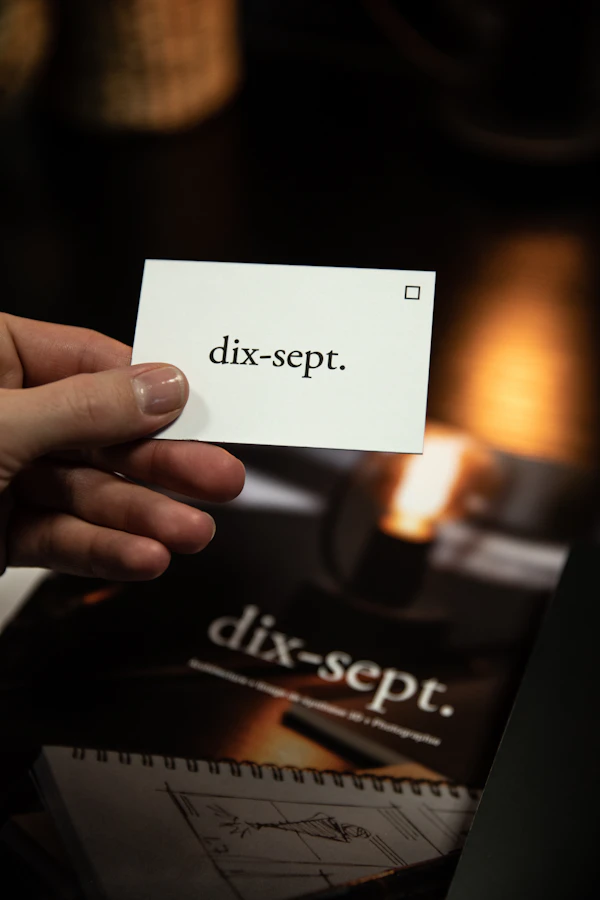 Hand holding a business card