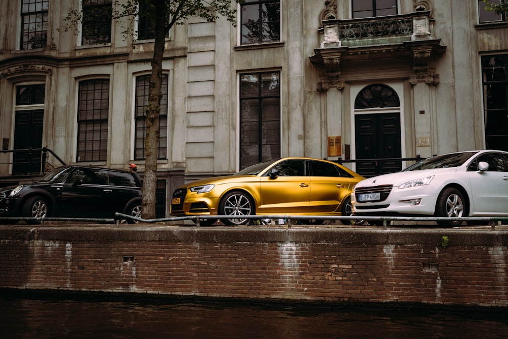 white and yellow cars on road during daytime