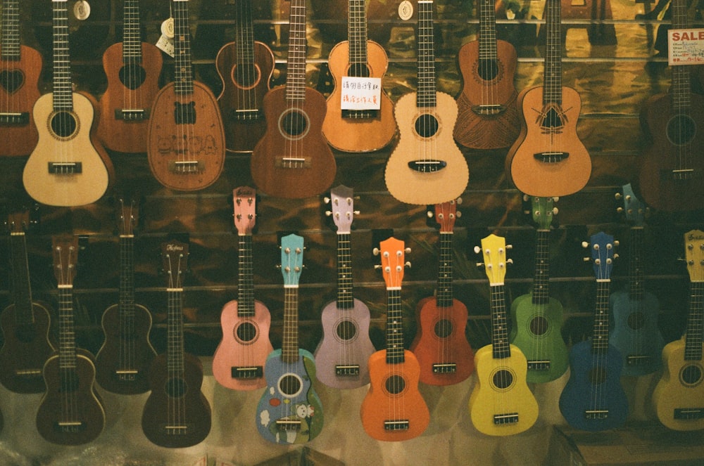 brown acoustic guitars on black steel rack