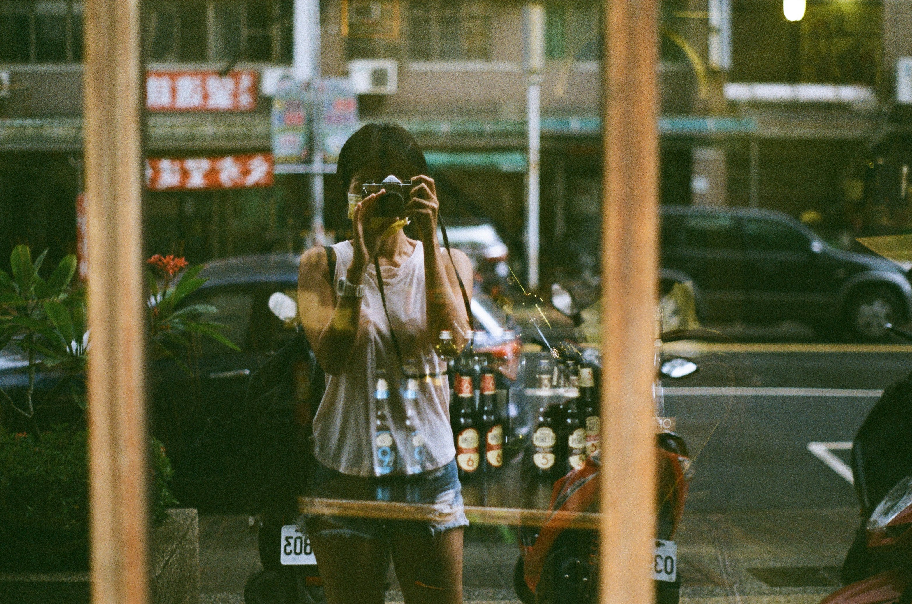 Woman pausing beside a cafe window