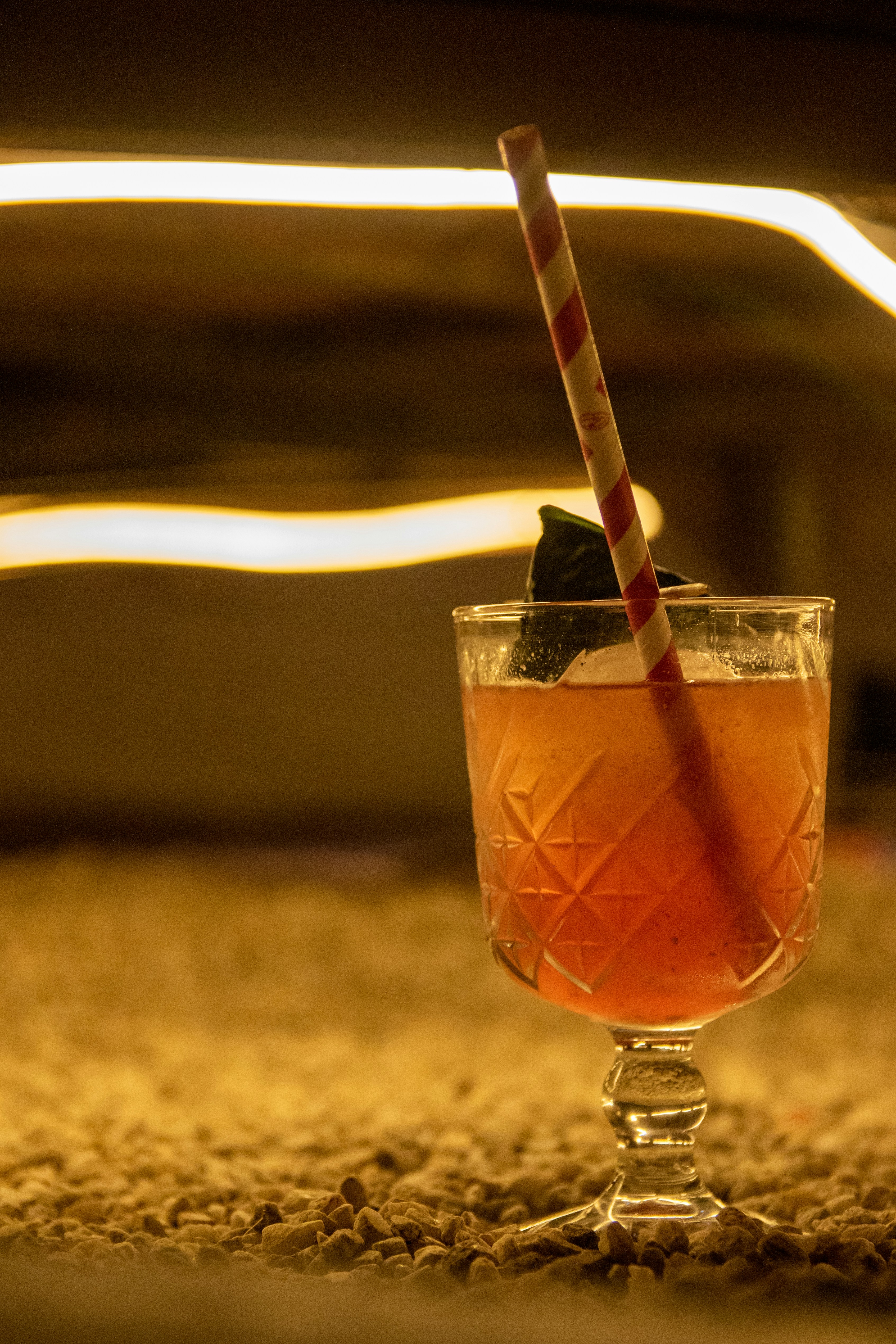 clear wine glass with orange liquid