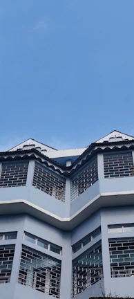 Completed commercial building featuring royal blue and white exterior design.