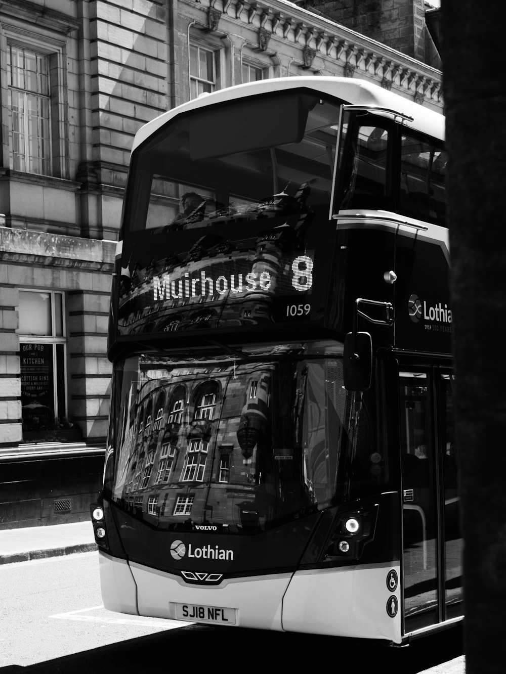 grayscale photo of double decker bus