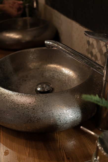 Elegant stone basin with smooth curves illuminated by soft ambient lighting