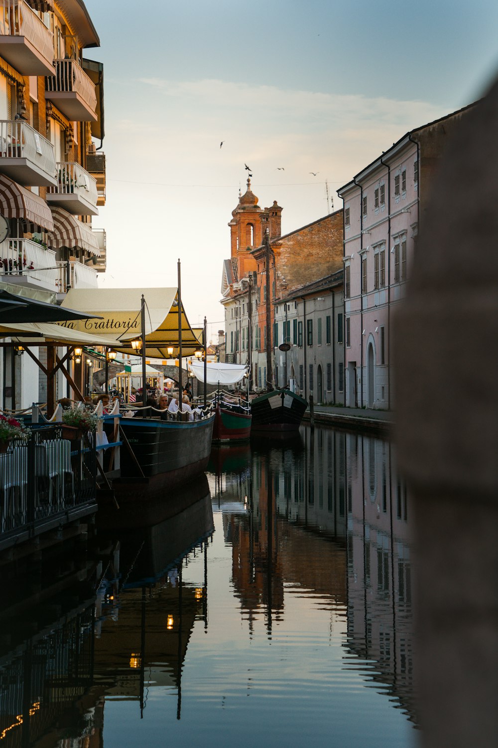 boat on river near buildings during daytime