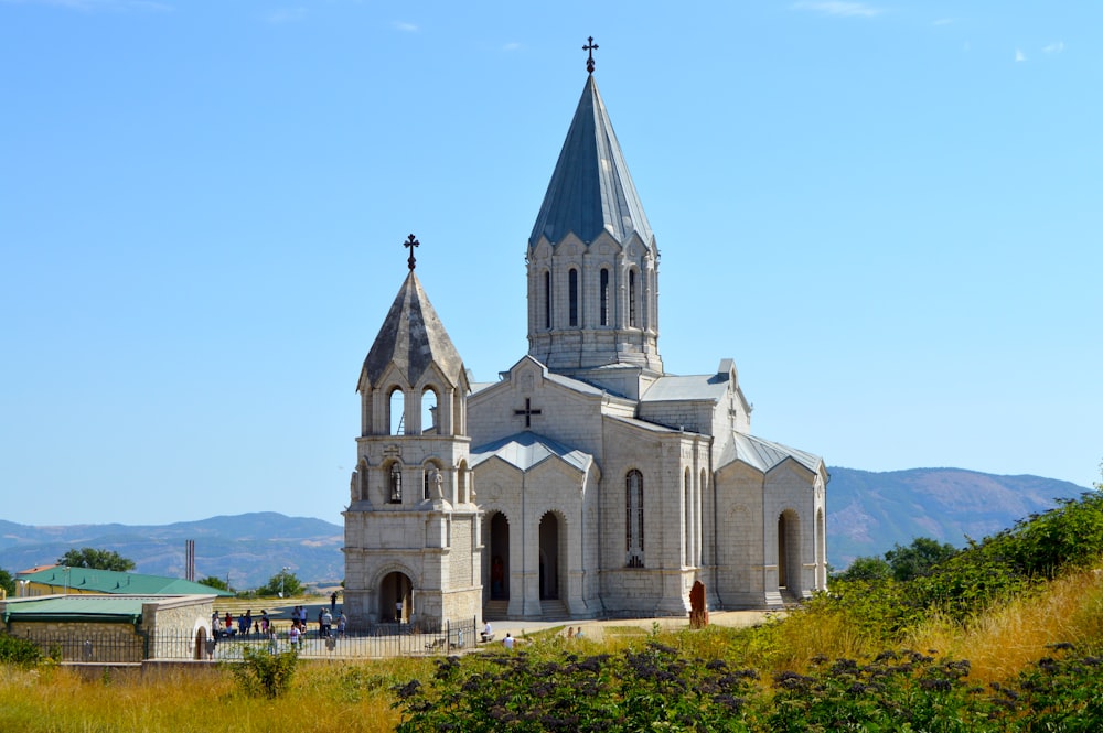 gray and white concrete church under blue sky during daytime