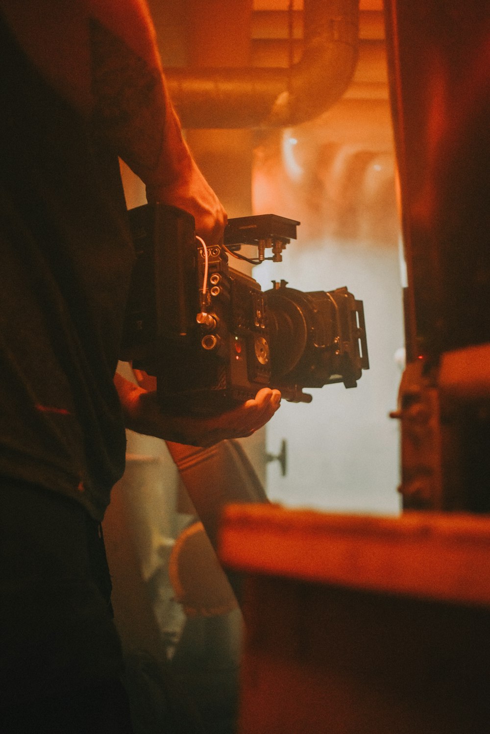 person holding black dslr camera