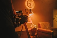 black and silver radio near white wall clock