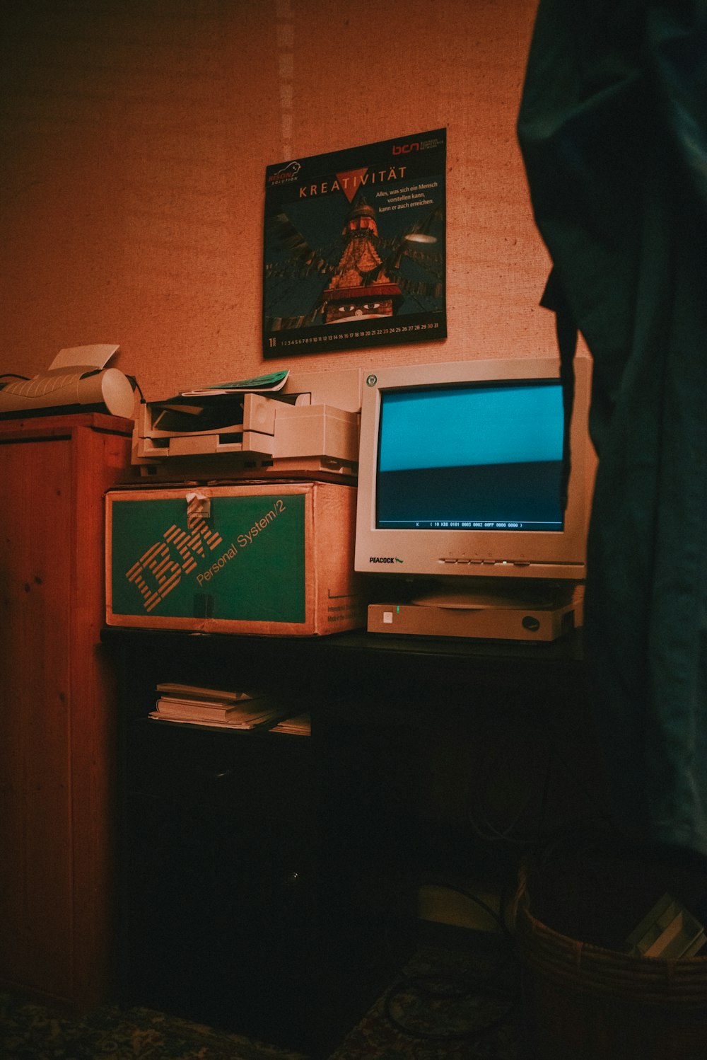 silver crt computer monitor on brown wooden desk