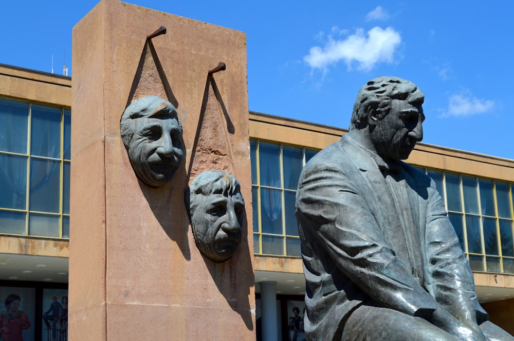 man in black suit statue