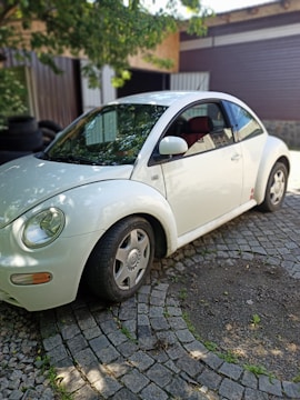 A car parked safely in a driveway, representing protection.