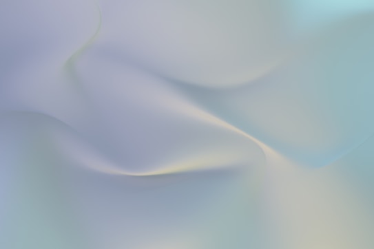 Soft and smooth gradients of pale blue and light gray blend fluidly together, creating an abstract and serene visual effect. The gentle curves suggest a sense of calm and fluidity.