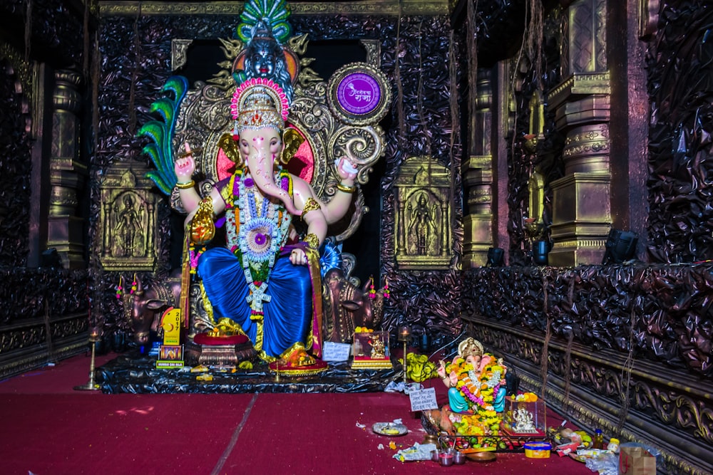 hindu deity figurine on red table