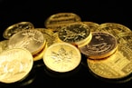 gold coins in a pile symbolizing multiple ways a gold ira can benefit retirement savings