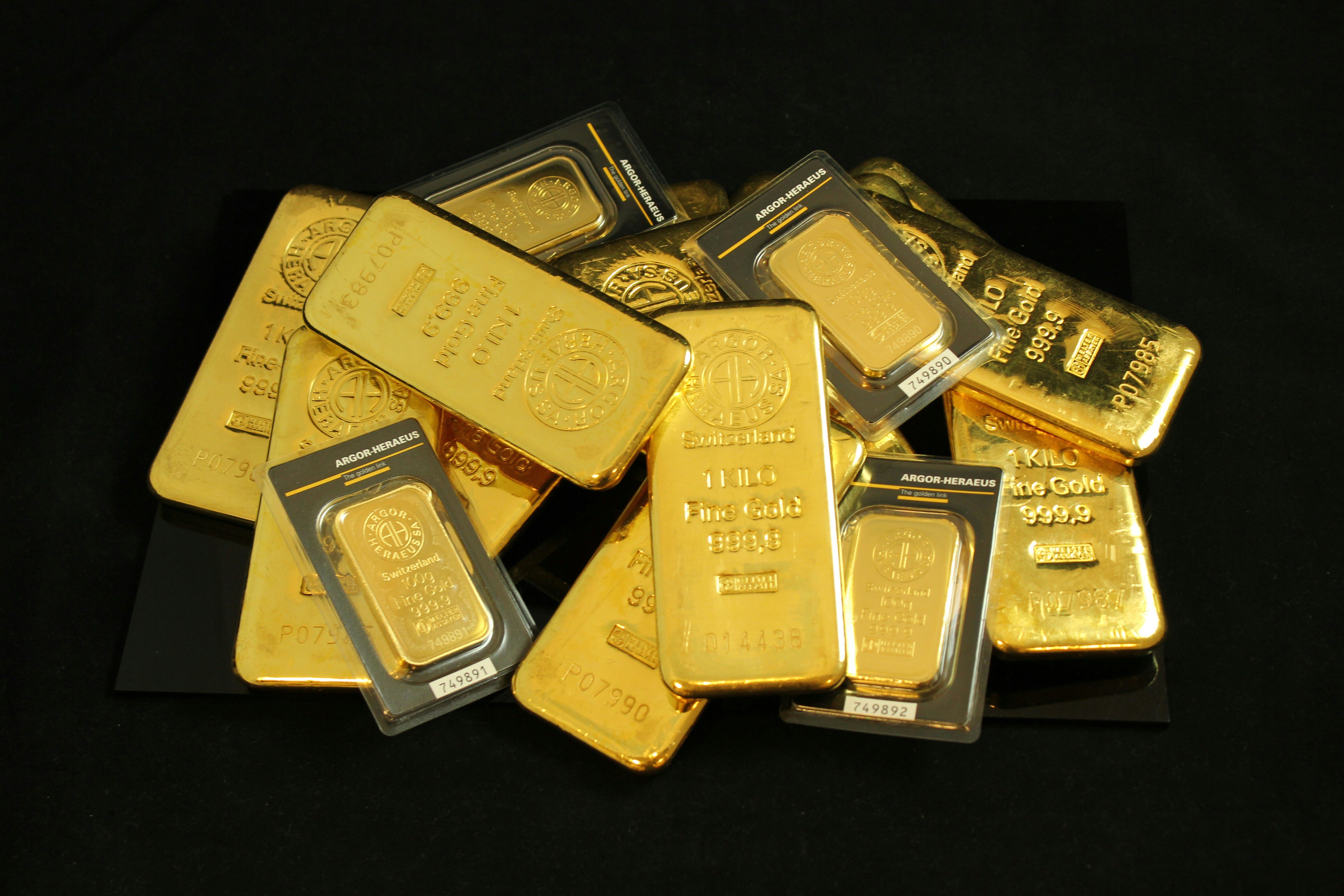 Pile of gold bullion coins and bars Argor Heraeus. If you use our photos, please add credit to https://zlataky.cz, when possible