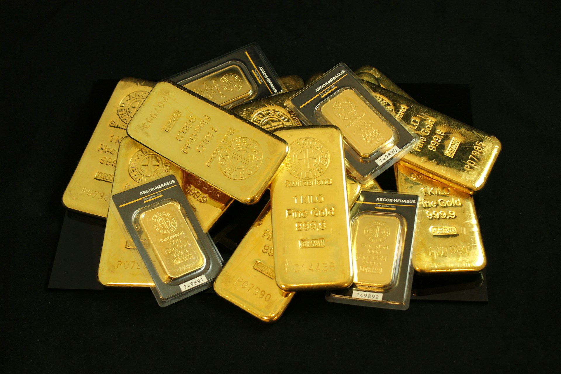 Gold bars and precious metals background for process page hero