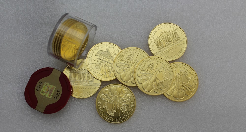 gold coins on white table
