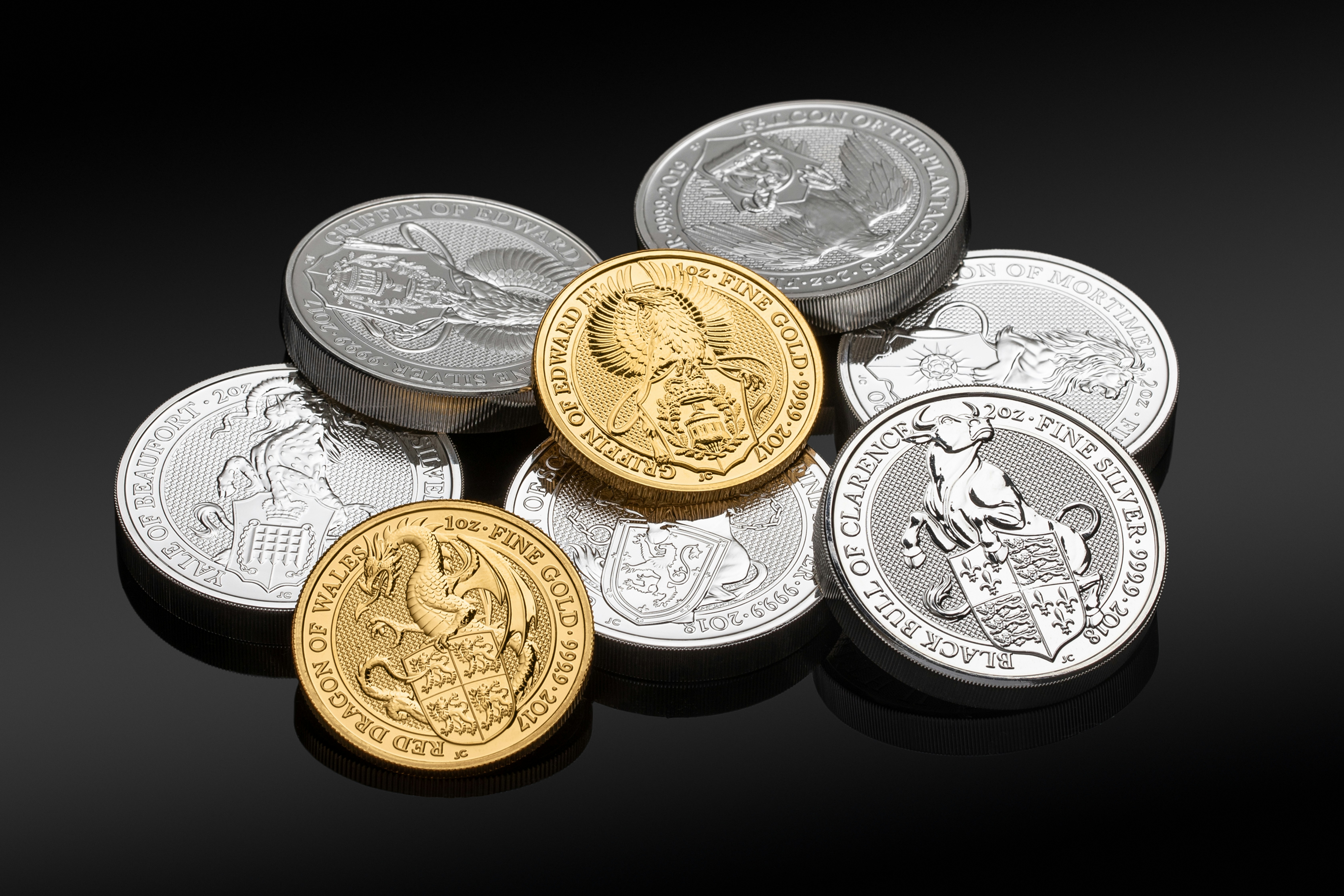 Pile of gold and silver bullion coins Queen´s beast. If you use our photos, please add credit to https://zlataky.cz, when possible