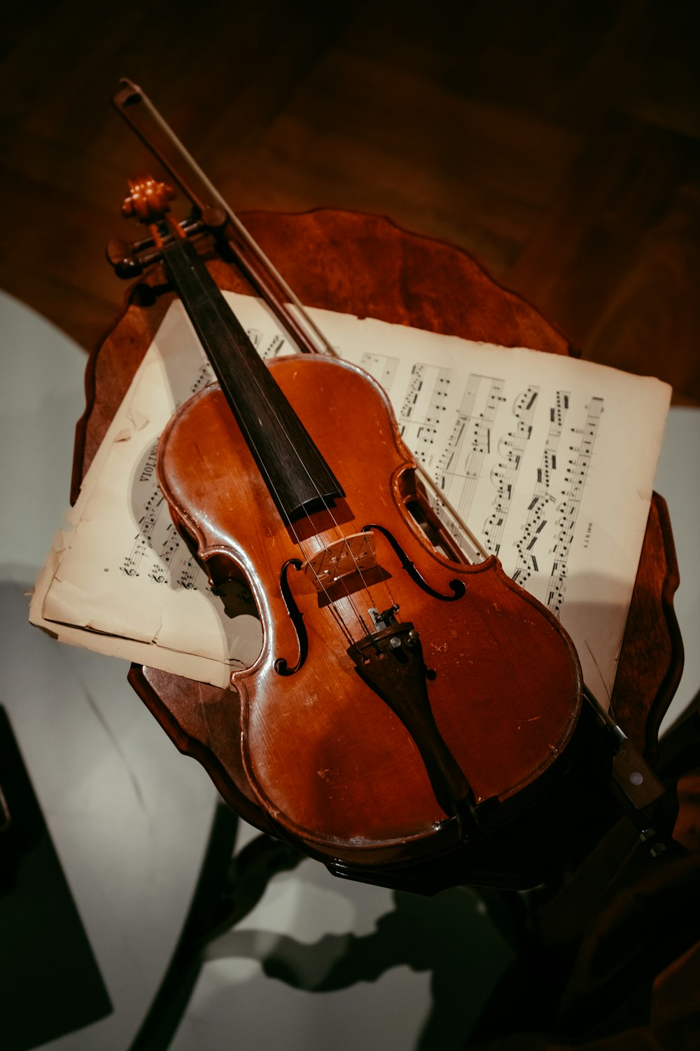 brown violin on white paper