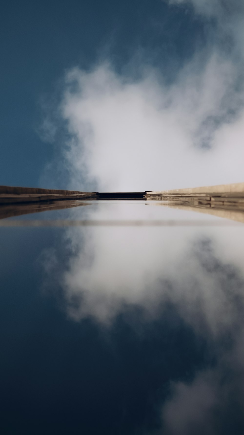 brown wooden dock over the clouds