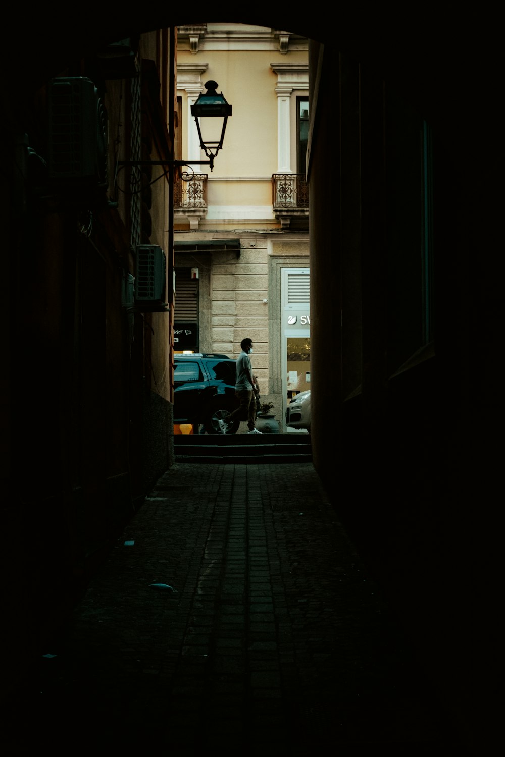 man in black jacket sitting on black motorcycle during daytime