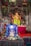A serene altar adorned with ladoo gopal ji and colorful pooja items.