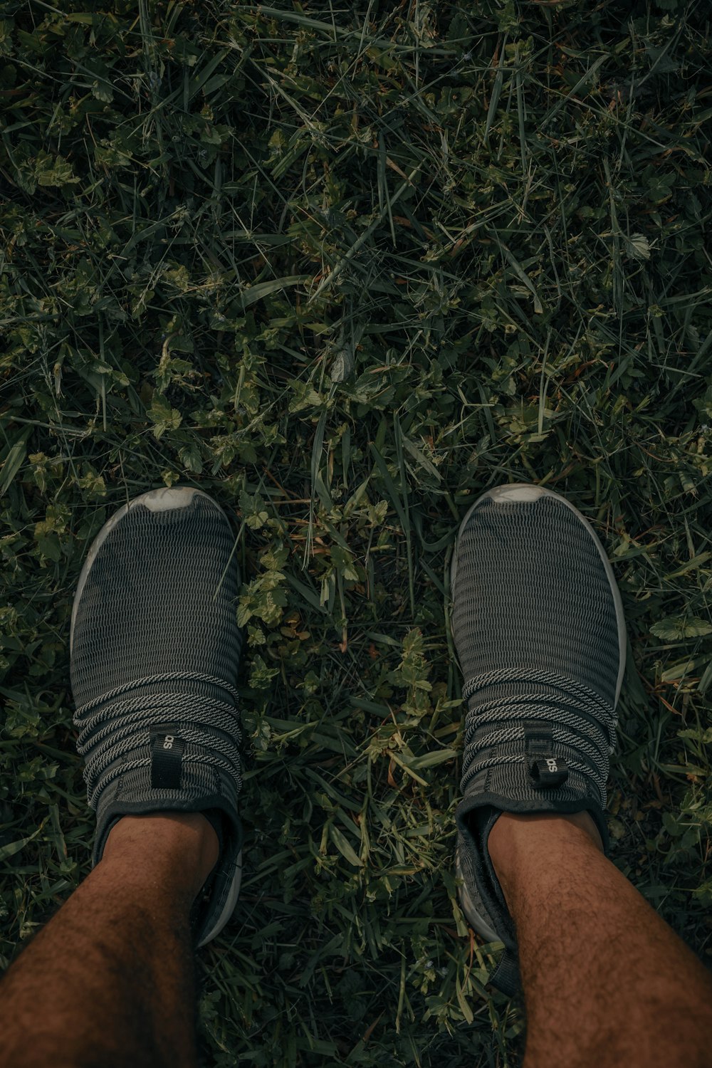 person wearing black and white running shoes