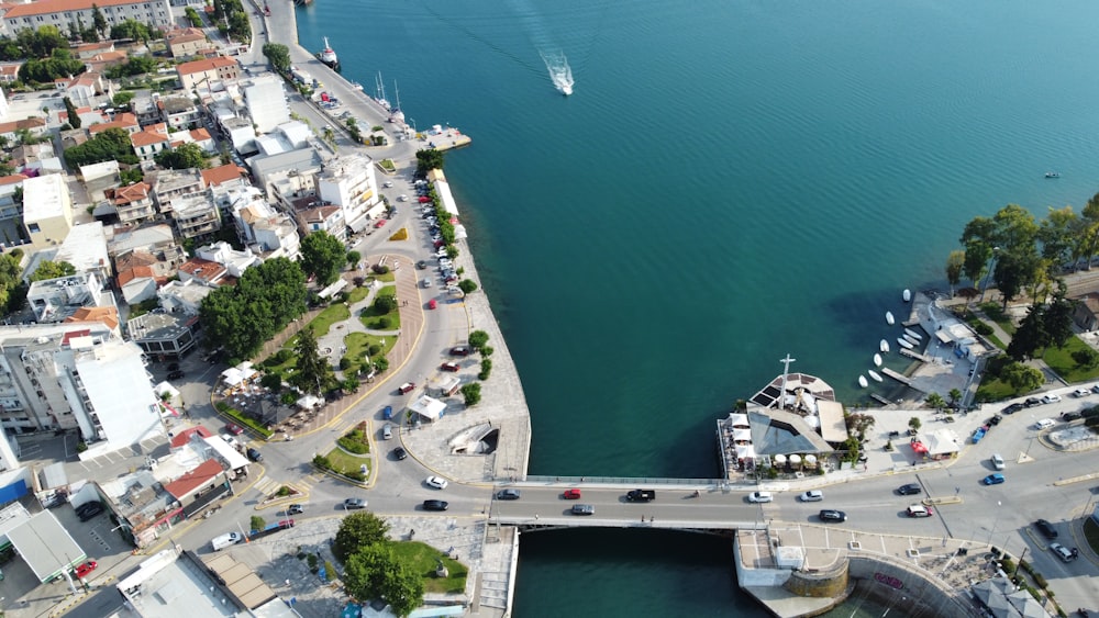 aerial view of city buildings near body of water during daytime