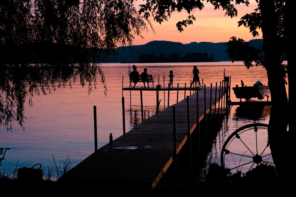 people walking on wooden dock during daytime