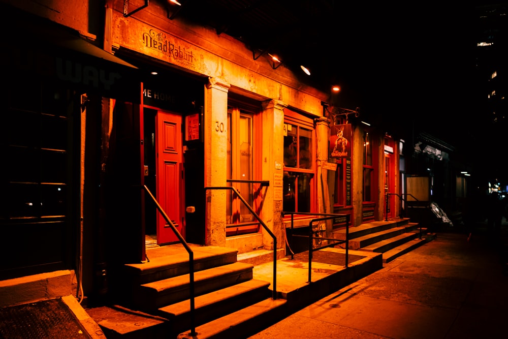 red and brown concrete building during night time