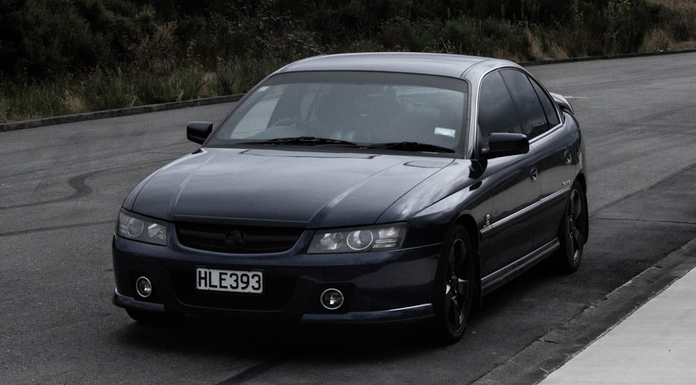 black mercedes benz coupe on road during daytime