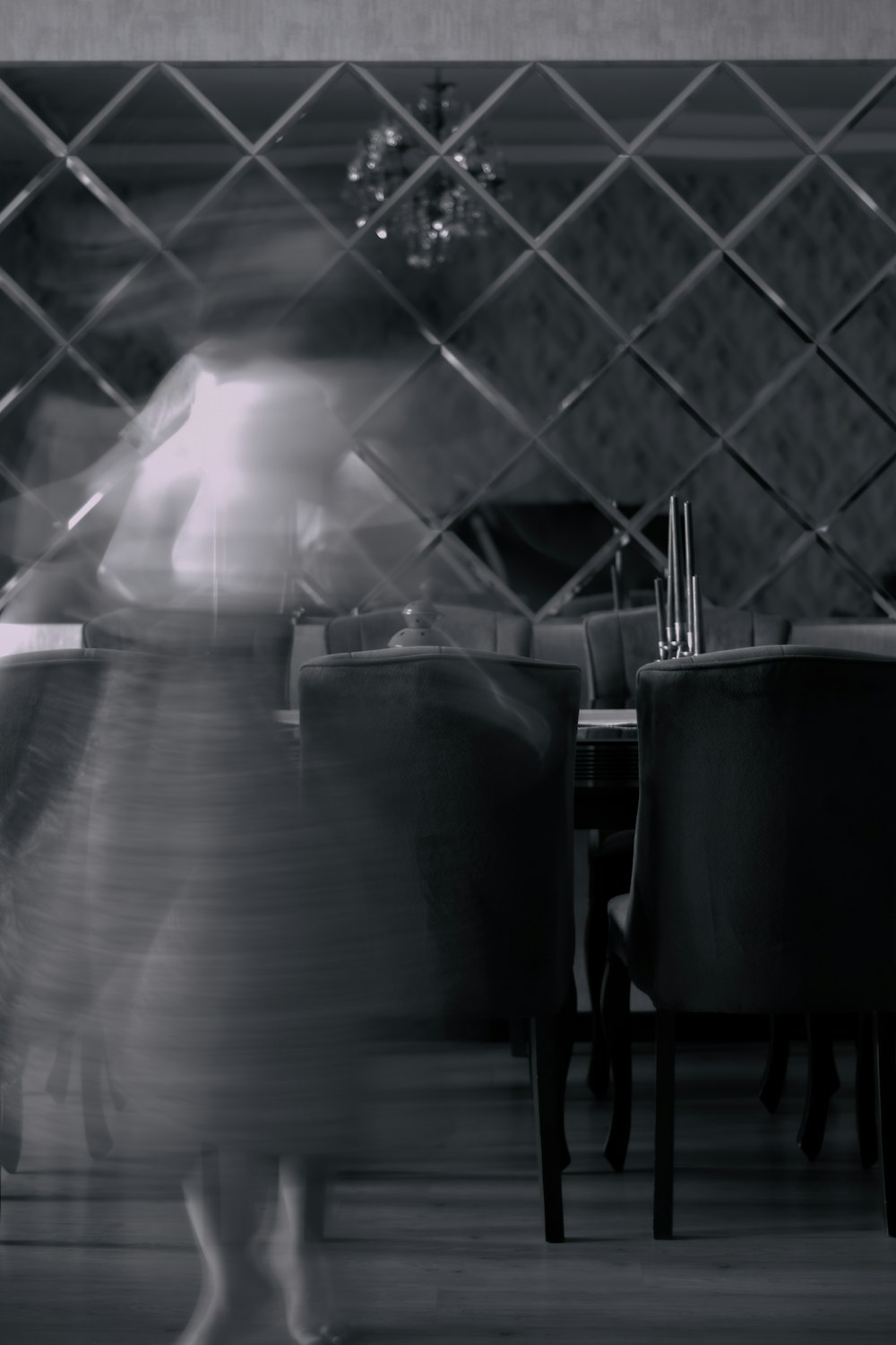 black chairs and table in grayscale photography