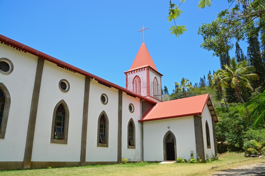 white and red church under blue sky during daytime