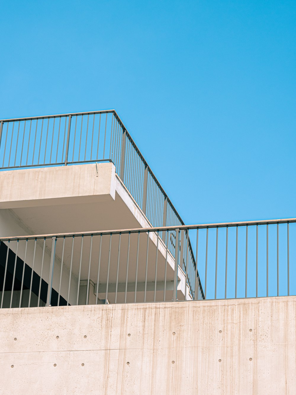 white concrete building under blue sky during daytime