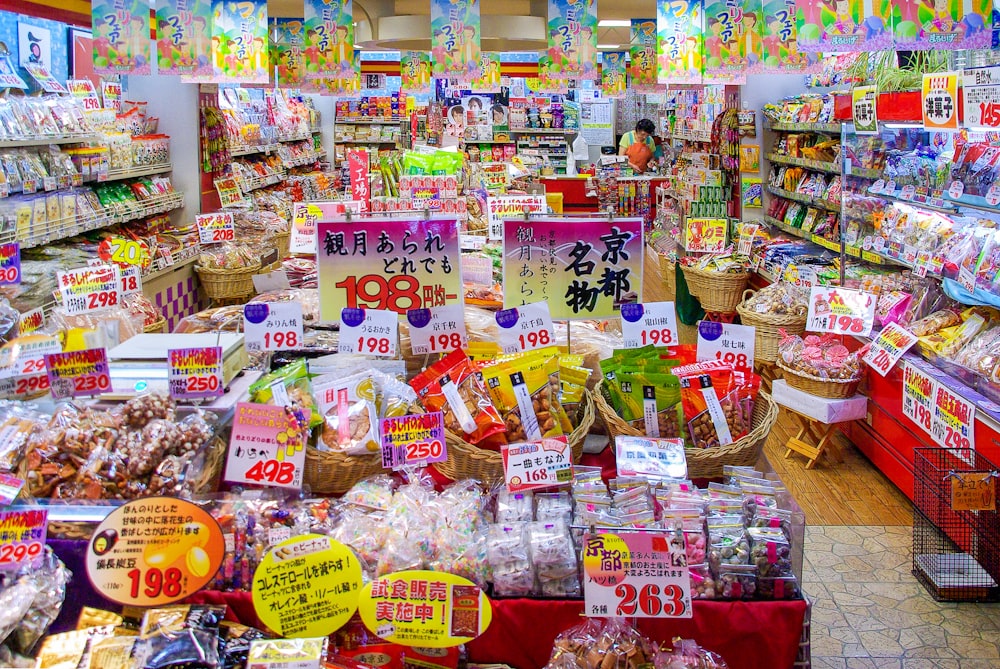 assorted plastic packs on white shelf